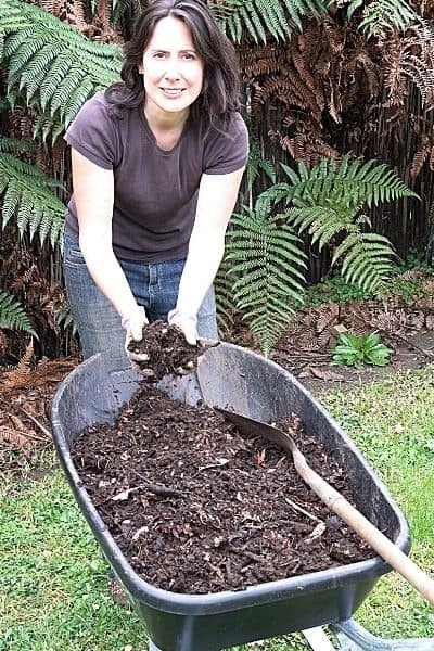 woman handling compost