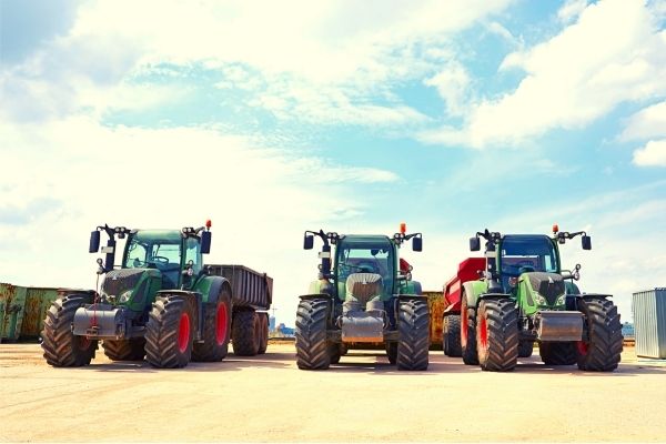 three heavy duty industrial tractors